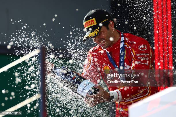 Race winner Carlos Sainz of Spain and Ferrari celebrates on the podium during the F1 Grand Prix of Australia at Albert Park Circuit on March 24, 2024...