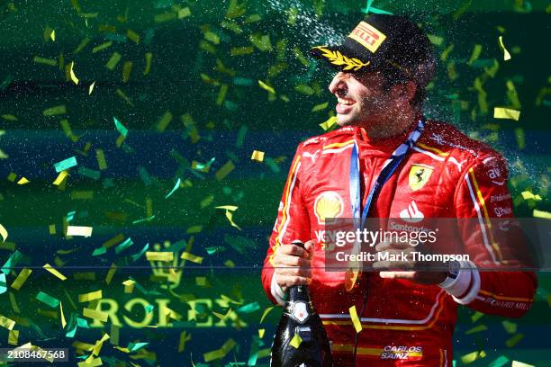 Race winner Carlos Sainz of Spain and Ferrari celebrates on the podium during the F1 Grand Prix of Australia at Albert Park Circuit on March 24, 2024...