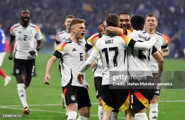 Florian Wirtz of Germany celebrates as he scores the goal 0:1withJoshua Kimmich of Germany Ilkay Guendogan of Germany during the international...