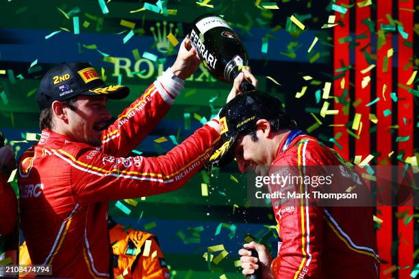 Race winner Carlos Sainz of Spain and Ferrari and Second placed Charles Leclerc of Monaco and Ferrari celebrate on the podium during the F1 Grand...