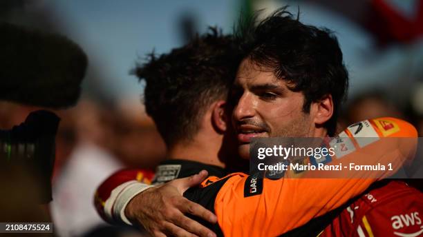 Race winner Carlos Sainz of Spain and Ferrari and Third placed Lando Norris of Great Britain and McLaren celebrate in parc ferme during the F1 Grand...