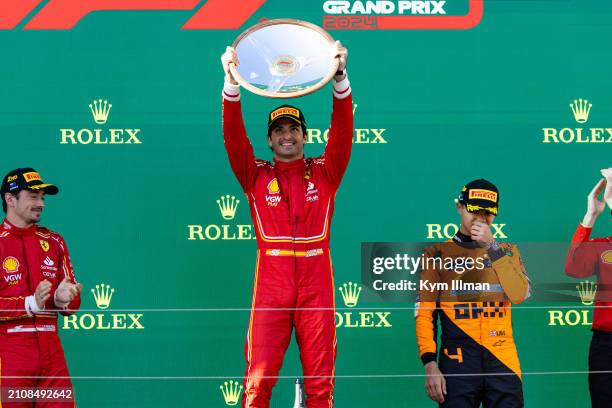 Carlos Sainz of Spain and Scuderia Ferrari, Lando Norris of Great Britain and McLaren F1 and Charles Leclerc of Monaco and Scuderia Ferrari on the...