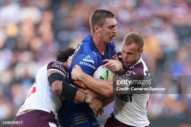 Shaun Lane of the Eels is tackled during the round three NRL match between Parramatta Eels and Manly Sea Eagles at CommBank Stadium, on March 24 in...