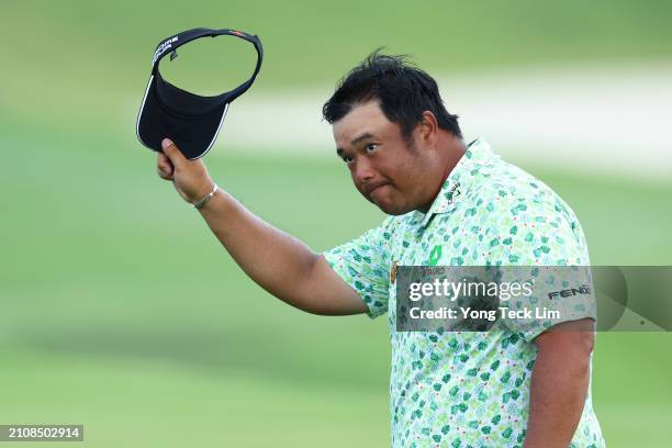 Kiradech Aphibarnrat of Thailand reacts after his eagle on the 18th hole during Day Four of the Porsche Singapore Classic at Laguna National Golf...