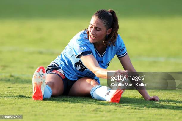 Margaux Chauvet of Sydney FC holds her foot as she sits on the ground during the A-League Women round 21 match between Sydney FC and Adelaide United...