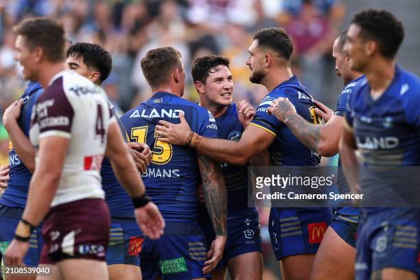 Mitchell Moses of the Eels celebrates with team mates close to full time during the round three NRL match between Parramatta Eels and Manly Sea...