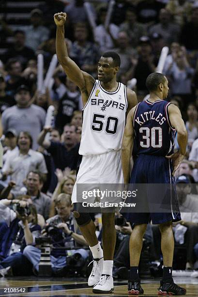 David Robinson of the San Antonio Spurs celebrates after making a basket against the New Jersey Nets during game six of the 2003 NBA Finals on June...