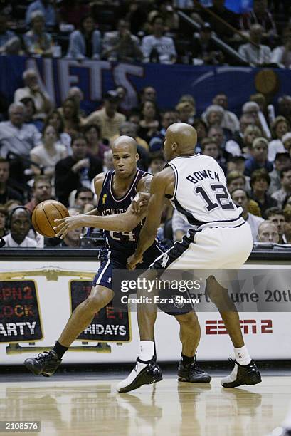 Richard Jefferson of the New Jersey Nets attempts to drive around Bruce Bowen of the San Antonio Spurs in game six of the 2003 NBA Finals on June 15,...