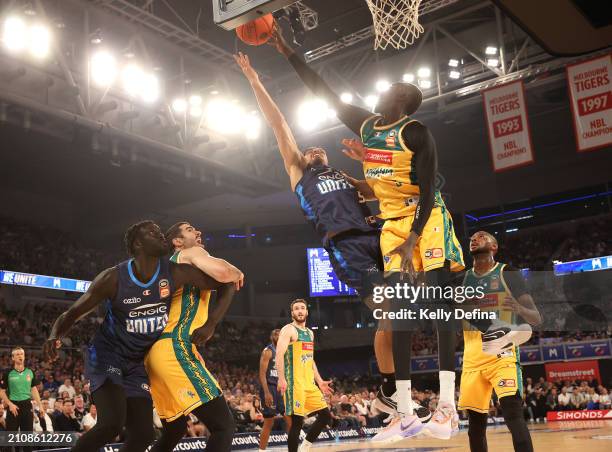 Shea Ili of United drives to the basket against Majok Deng of the JackJumpers during game three of the NBL Championship Grand Final Series between...