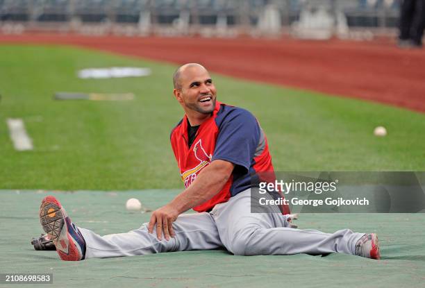 Albert Pujols of the St. Louis Cardinals smiles as he stretches before a game against the Pittsburgh Pirates at PNC Park on August 16, 2011 in...