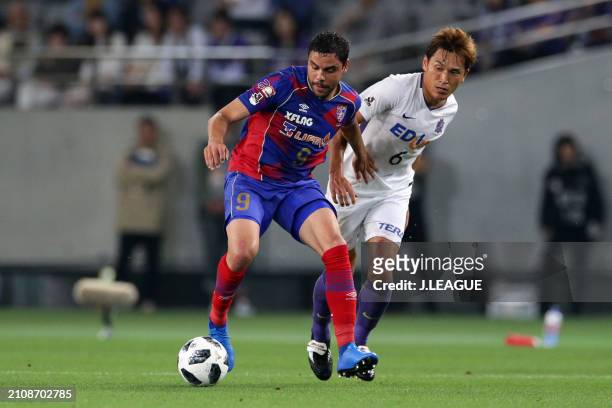 Diego Oliveira of FC Tokyo controls the ball against Toshihiro Aoyama of Sanfrecce Hiroshima during the J.League J1 match between FC Tokyo and...