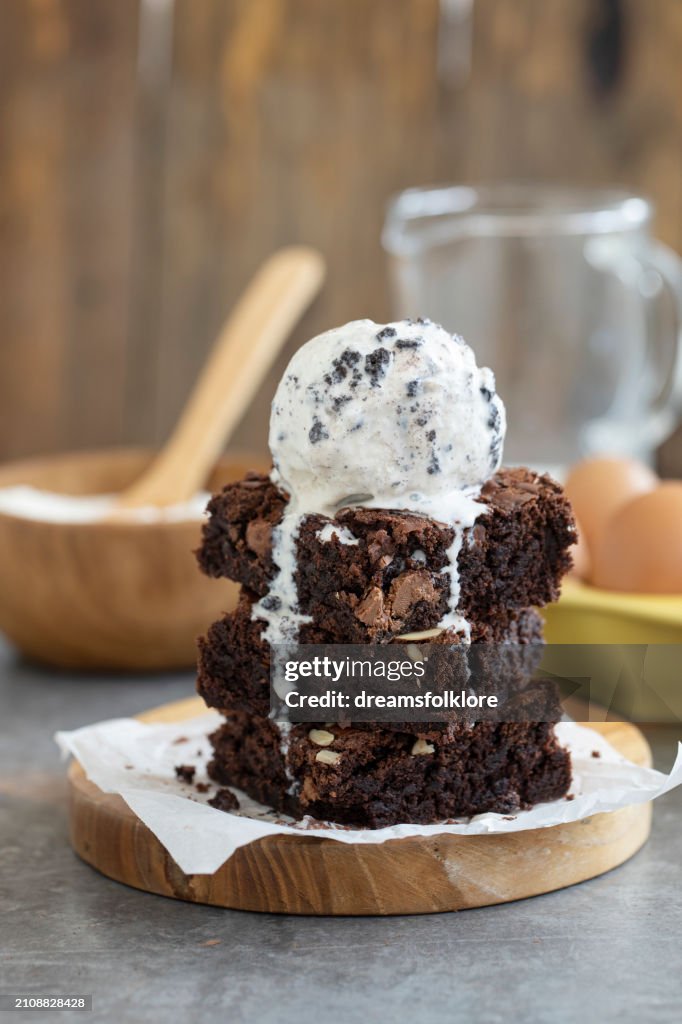 Brownie dessert with ice cream on the wodden plate