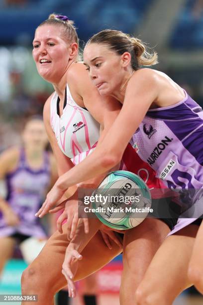 Lucy Austin of The Thunderbirds competes with Isabelle Shearer of the Firebirds during the 2024 Suncorp Team Girls Cup match between the Thunderbirds...