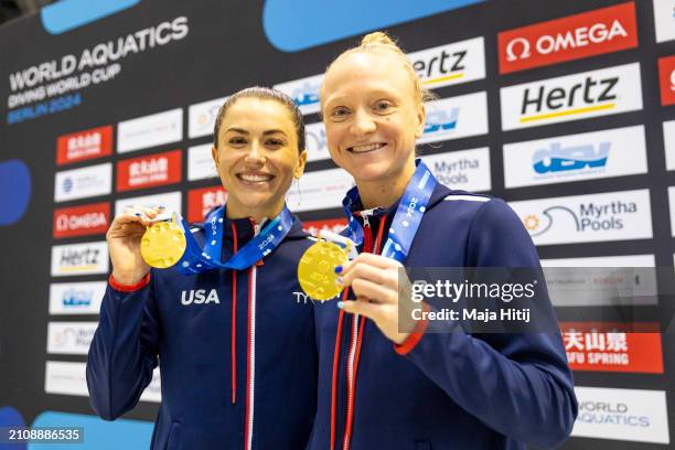 Sarah Bacon and Kassidy Cook of Team USA pose with gold medal after the Women's Synchronized 3m Springboard Final during the World Aquatics Diving...