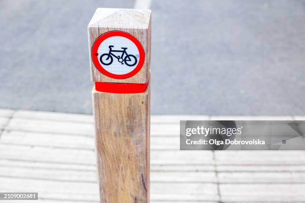 'no cycling' sign on a  wooden post - forbidden symbol stock pictures, royalty-free photos & images