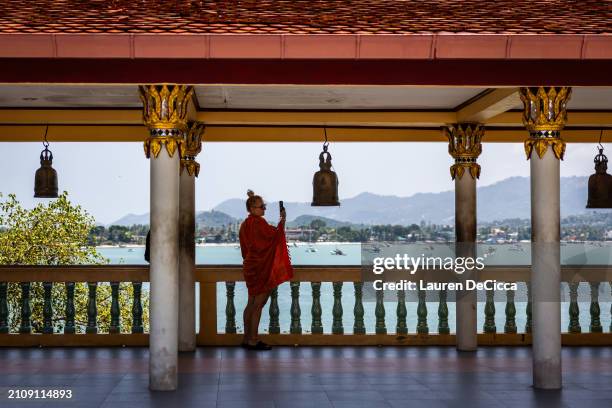 Tourist takes a photo from the Big Buddha viewpoint on March 23, 2024 in Koh Samui, Thailand. The upcoming season of "The White Lotus" is anticipated...