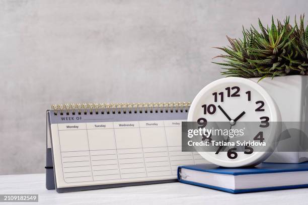 white clock and calendar side view - personal organiser stock pictures, royalty-free photos & images