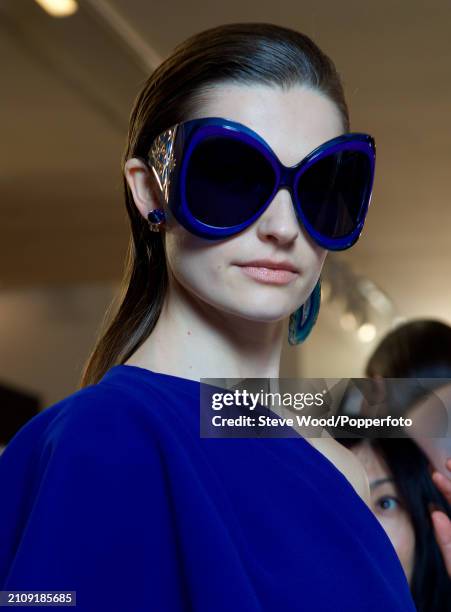 Model Laura Schoenmakers backstage at the Elie Saab Couture show during Paris Fashion Week Spring/Summer 2019, she wears a one sleeved evening gown...