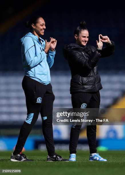 Jade Richards and Alexandra Brooks of Blackburn Rovers react as they inspect the pitch prior to the Barclays Women's Championship match between...