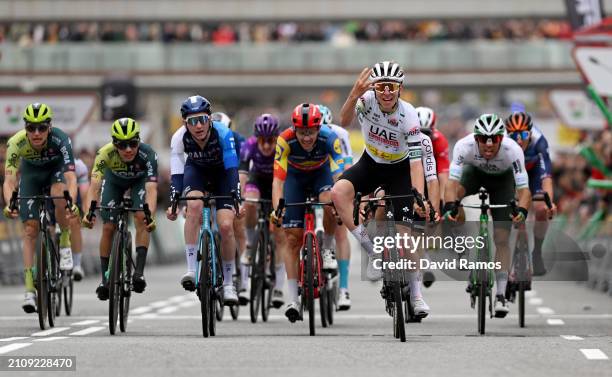 Tadej Pogacar of Slovenia and UAE Emirates Team - Green Leader Jersey celebrates at finish line as stage winner ahead of Stephen Williams of Great...