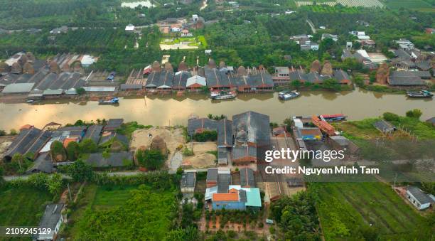 mang thit ancient brick village under sunset, mekong delta, vinh long province - brazier stock pictures, royalty-free photos & images