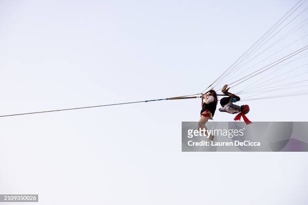 Tourist goes parasailing on Patong Beach on March 24, 2024 in Phuket, Thailand. Thailand's tourism sector is experiencing a notable rebound, driven...