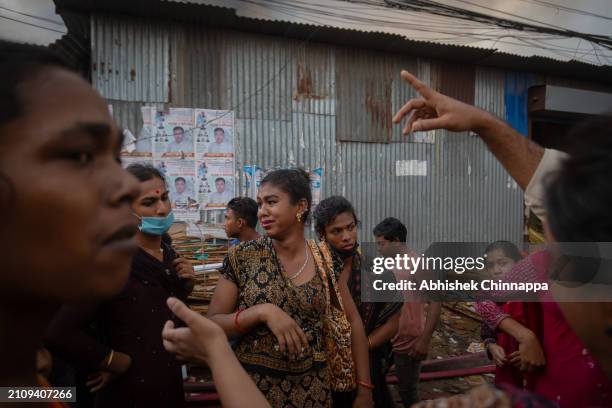 Transgendered person cries as their house burns down in a fire which engulfed a slum dwelling on March 24, 2024 in the Banani neighbourhood of Dhaka,...