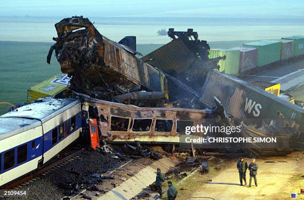 The cars of a passenger train and a goods train sit in a twisted pile after a collision in Chinchilla, , early 04 June 2003. At least three people...