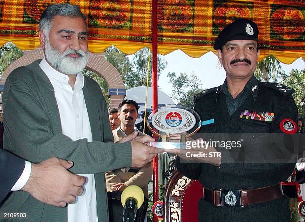 An undated picture shows Saeed Khan , Inspector General of police in North West Frontier Province and NWFP Chief Minister Akram Durrani posing for...