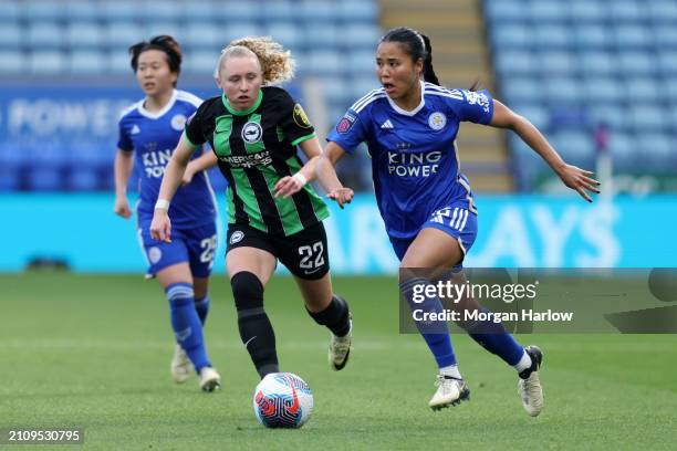 Asmita Ale of Leicester City runs with the ball whilst under pressure from Katie Robinson of Brighton & Hove Albion during the Barclays Women's Super...