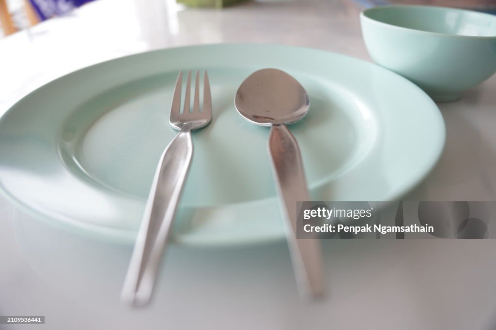 Spoon and fork on plate