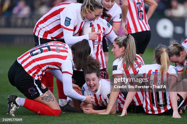 Mary McAteer of Sunderland celebrates scoring her team's second goal with teammates during the Barclays Women's Championship match between Sunderland...