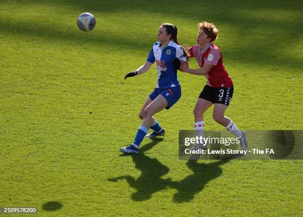 Lucy Shepherd of Blackburn Rovers is challenged by Milly Mott of Southampton FC during the Barclays Women's Championship match between Blackburn...