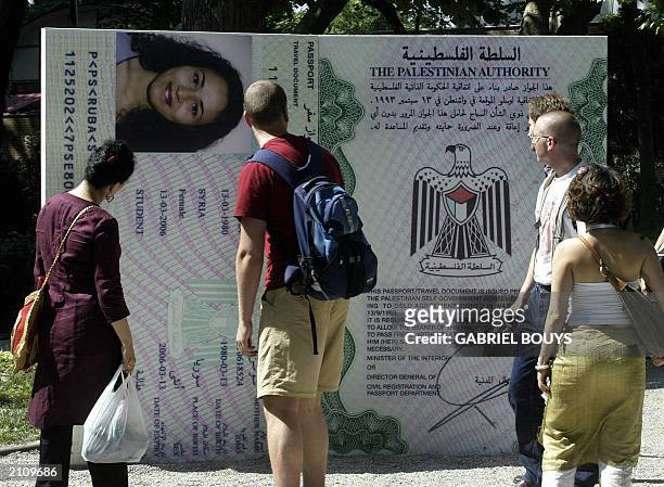 Visitors look at the installation "Stateless Nation" at the 5Oth Biennale of Art in Venice, 13 June 2003. "Stateless Nation", which includes...