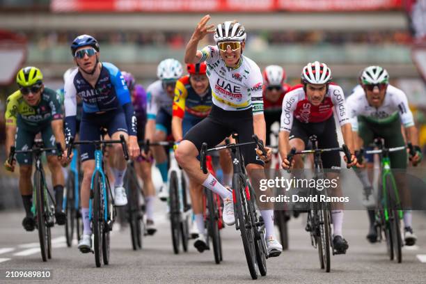 Tadej Pogacar of Slovenia and UAE Emirates Team - Green Leader Jersey celebrates at finish line as stage winner ahead of Stephen Williams of Great...