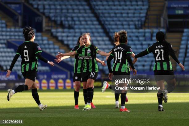 Julia Zigiotti Olme of Brighton & Hove Albion celebrates her team's first goal with teammates scored by Madison Haley during the Barclays Women's...