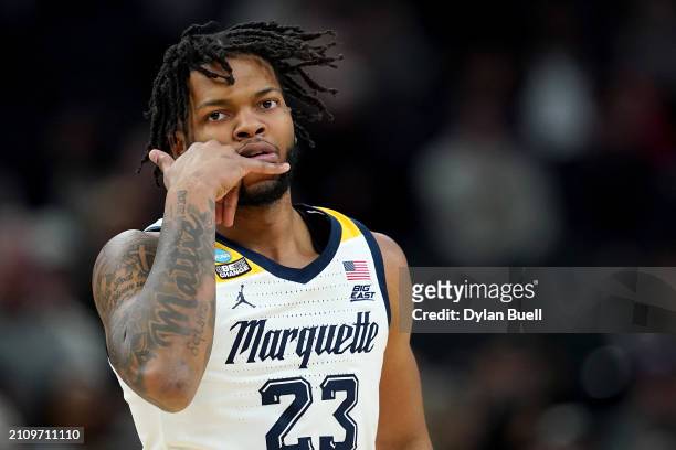 David Joplin of the Marquette Golden Eagles celebrates a three point basket against the Colorado Buffaloes during the first half in the second round...