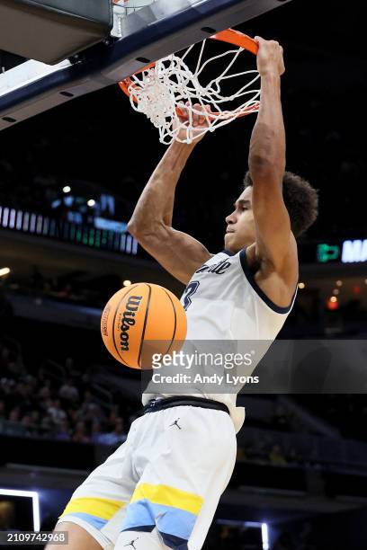 Oso Ighodaro of the Marquette Golden Eagles dunks the ball against the Colorado Buffaloes during the first half in the second round of the NCAA Men's...
