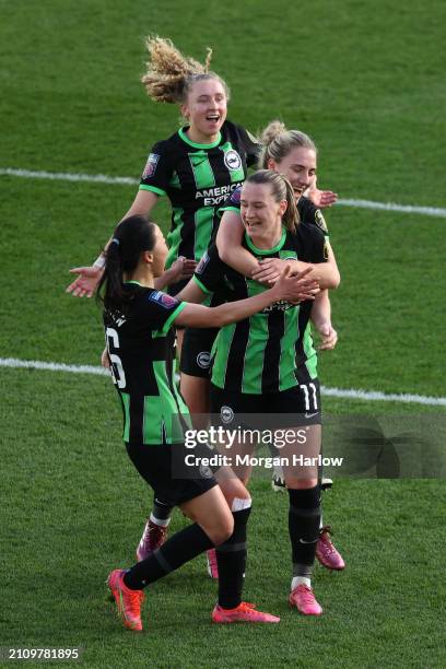 Elisabeth Terland of Brighton & Hove Albion celebrates scoring her team's third goal with teammates during the Barclays Women's Super League match...