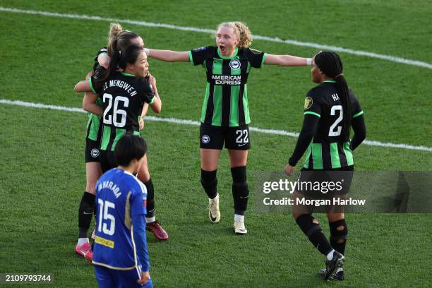 Katie Robinson of Brighton & Hove Albion celebrates her team's third goal scored by teammate Elisabeth Terland during the Barclays Women's Super...