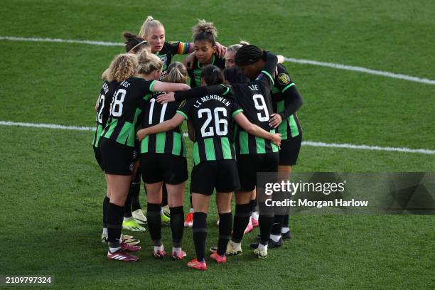 Players of Brighton & Hove Albion huddle after Elisabeth Terland of Brighton & Hove Albion scores the team's third goal during the Barclays Women's...