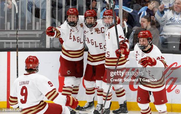 Will Smith of the Boston College Eagles celebrates his third goal of four on the game against the Boston University Terriers with his teammates Ryan...