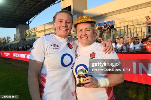 Marlie Packer of England poses for a photo with Alex Matthews of England after being presented with her 100th appearance cap and trophy at full-time...