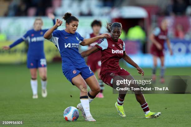 Jess Carter of Chelsea on the ball whilst under pressure from Viviane Asseyi of West Ham United during the Barclays Women's Super League match...