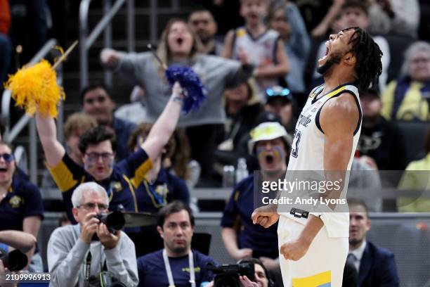 David Joplin of the Marquette Golden Eagles celebrates a basket against the Colorado Buffaloes during the second half in the second round of the NCAA...