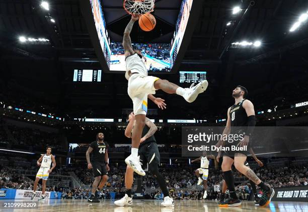 David Joplin of the Marquette Golden Eagles dunks the ball against the Colorado Buffaloes during the second half in the second round of the NCAA...