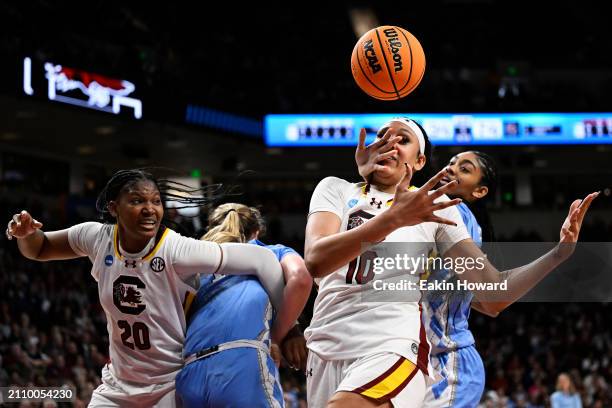 Kamilla Cardoso of the South Carolina Gamecocks and Teonni Key of the North Carolina Tar Heels reach for a rebound in the fourth quarter during the...