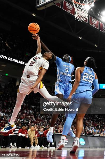 Maria Gakdeng of the North Carolina Tar Heels blocks a layup attempt by MiLaysia Fulwiley of the South Carolina Gamecocks in the fourth quarter...