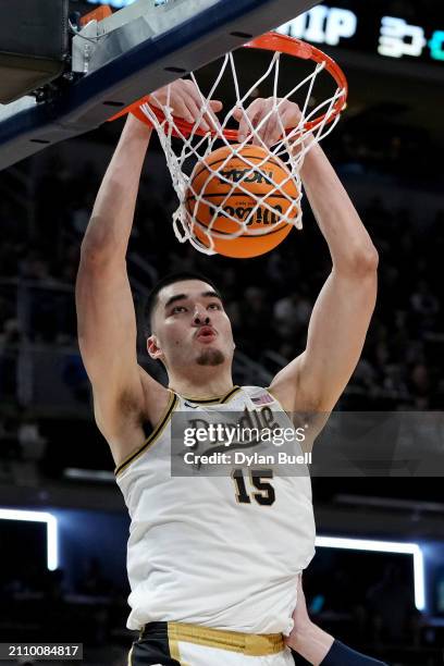 Zach Edey of the Purdue Boilermakers dunks the ball against the Utah State Aggies during the first half in the second round of the NCAA Men's...