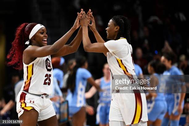 MiLaysia Fulwiley and Raven Johnson of the South Carolina Gamecocks celebrate against the North Carolina Tar Heels in the first quarter during the...